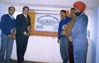 Mr Hridey Ray (third from right) receiving the award